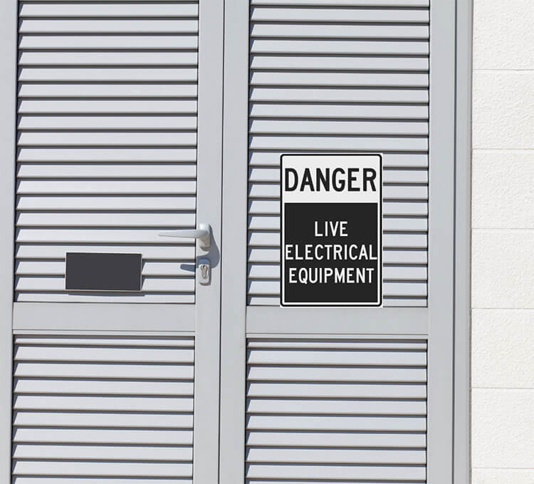 Door with the grey Compliance Sign